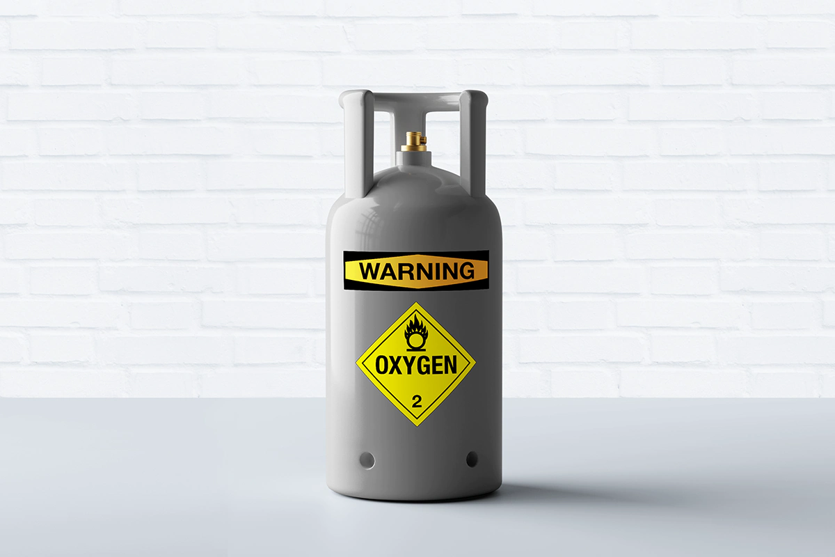 Oxygen tank with warning labels