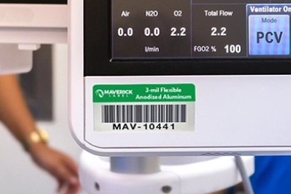 A close-up of a healthcare logistics label with a barcode on medical equipment, ensuring proper tracking and management in a clinical setting.